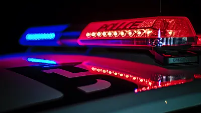 Police lights at night - Yorktown nursing home employee arrested